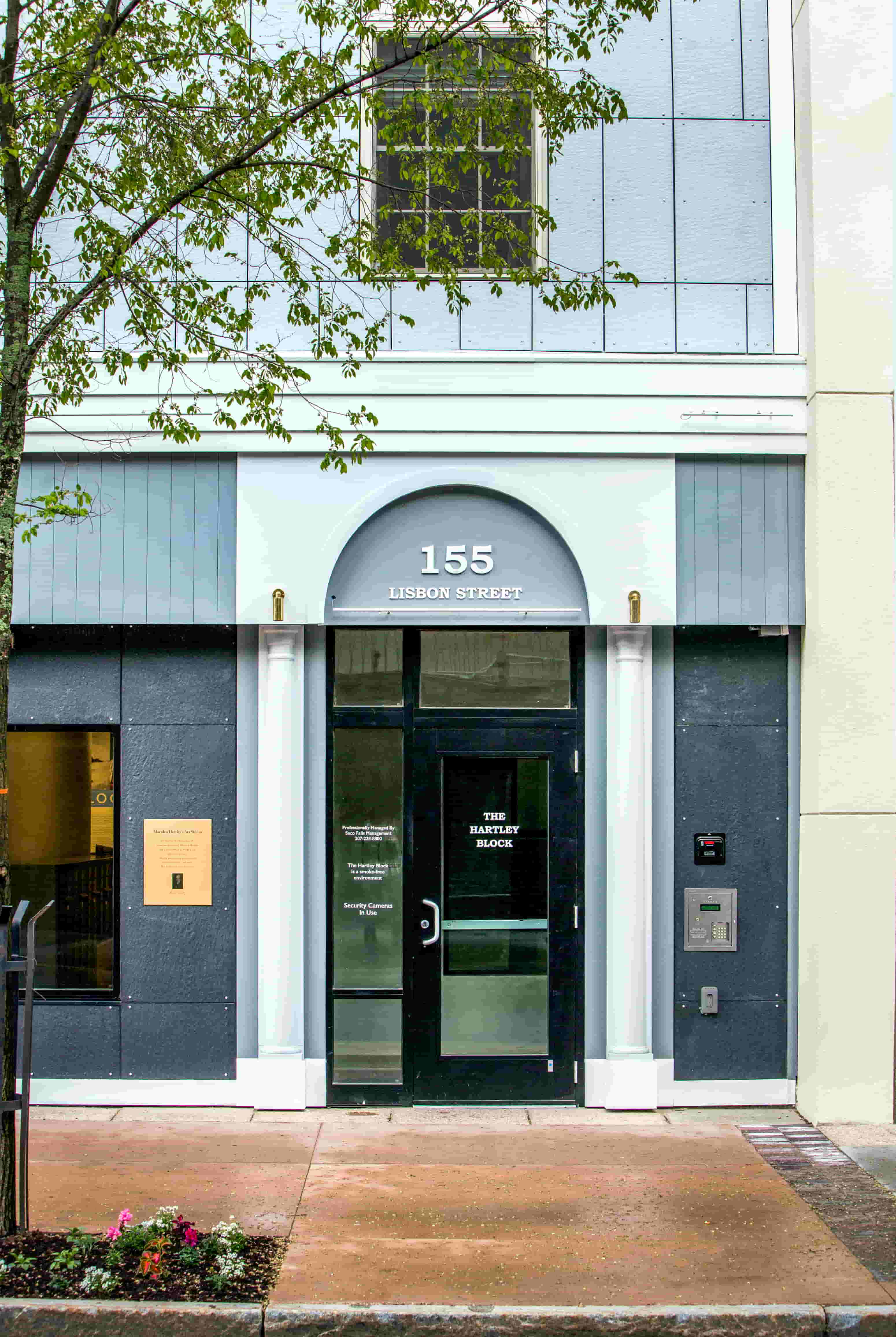 The front of a building with the number 155 on it.
