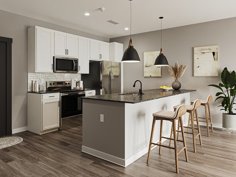 A kitchen with a black refrigerator and white cabinets.