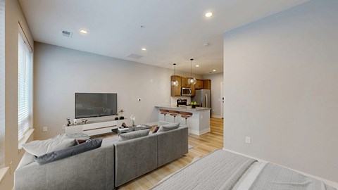 A modern kitchen with a dining table and chairs.
