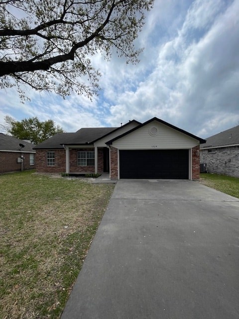 A detached house with a garage and a driveway.