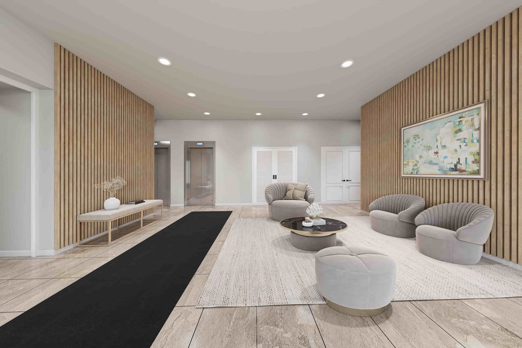 A modern living room with a black runner rug and grey armchairs.