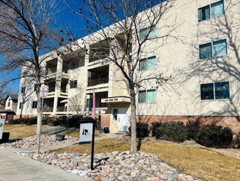 A building with a sign in front of it.