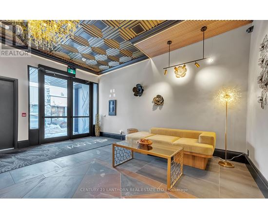 A modern living room with a yellow couch and a wooden coffee table.