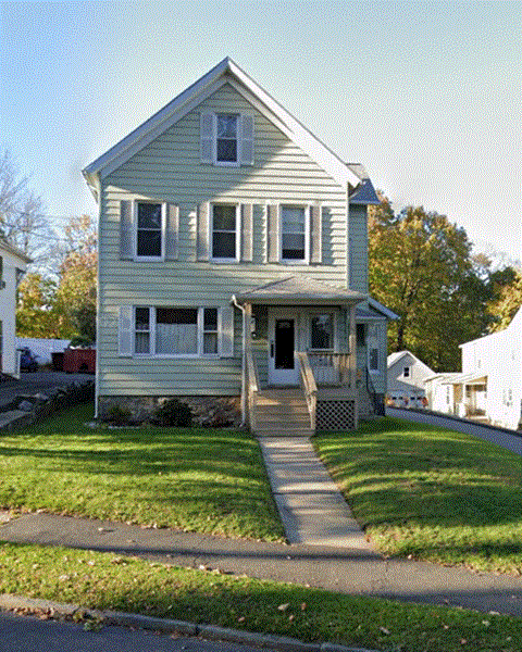 A two-story house with a front porch.