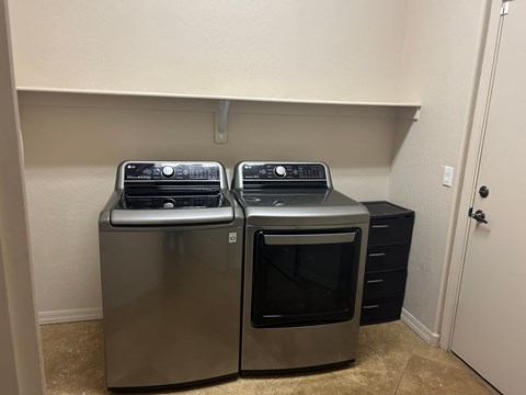 Two stainless steel ovens are in a kitchen.