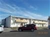 A white building with a sign that says "Motorama" on it.