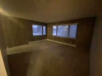 A room with brown walls and a window.