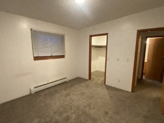 A room with a window and a door.