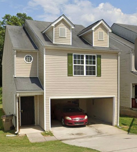 A two-car garage is attached to a house.
