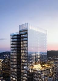 A tall building with many windows is shown in the image.