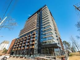 A tall building with a lot of windows is under construction.