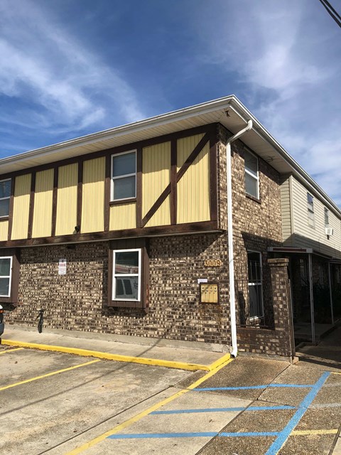 A building with a yellow and brown striped awning.