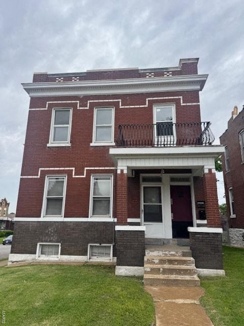 A red brick house with a white door and windows.