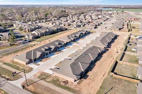 A large housing development with rows of houses and apartment buildings.