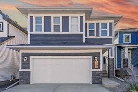 A modern two-story house with a white garage door.