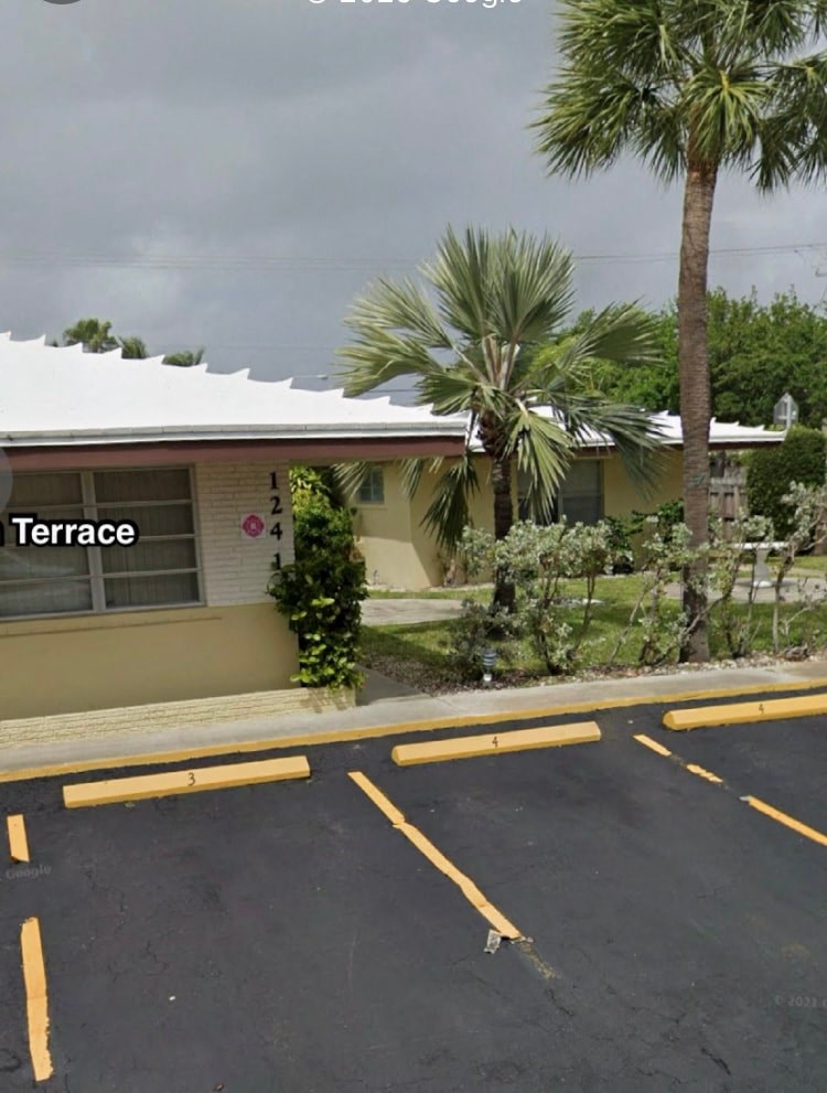 A parking lot with a building labeled Terrace in the background.