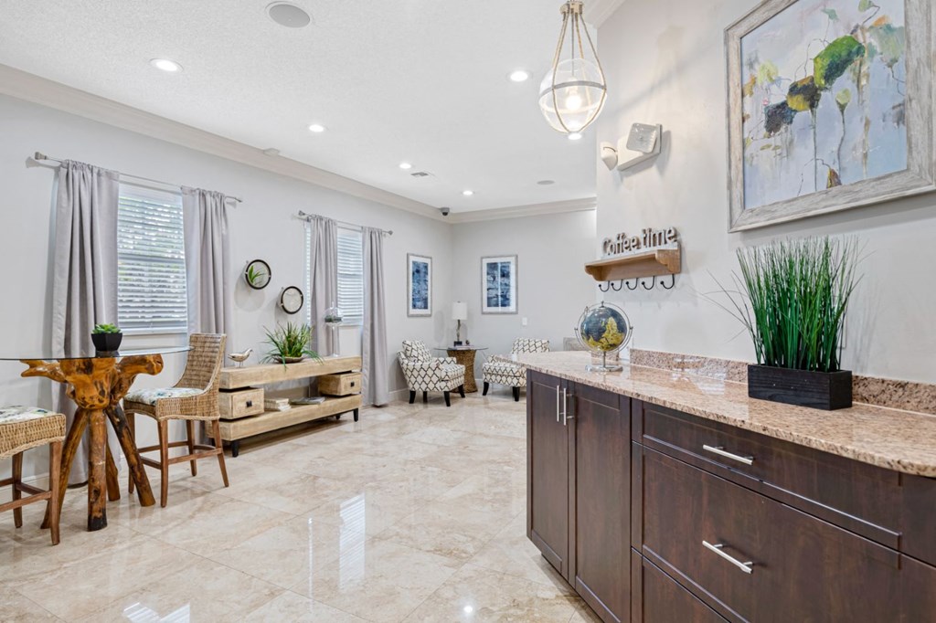 A kitchen with a wooden table and chairs.