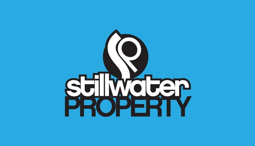 The image shows a logo with the text "stillwater PROPERTY" and a stylized water droplet design.