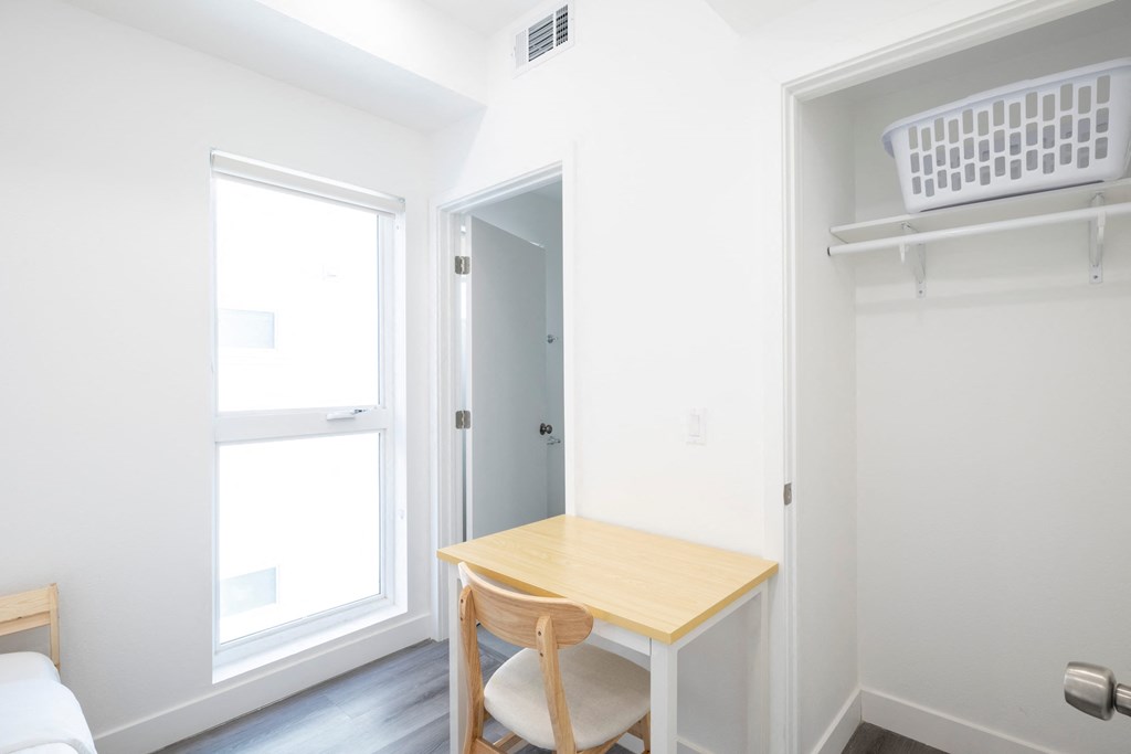 A small room with a table and a chair.