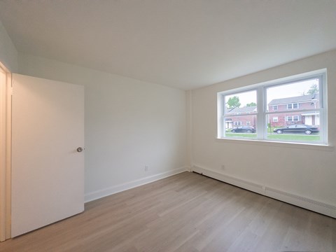 Empty room with a door and a window.