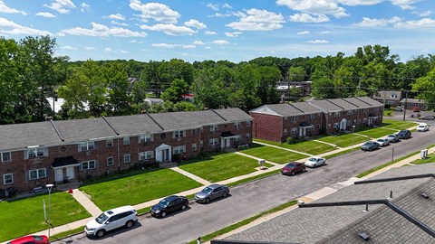 A white bathroom with a toilet, sink, and bathtub.