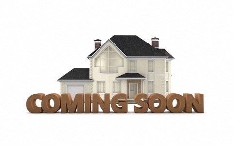 A house with the words "coming soon" in front of it.