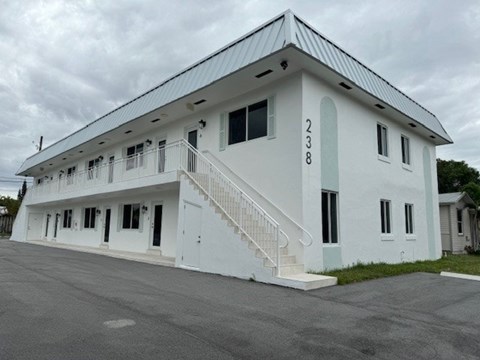 A white building with the number 238 on it.