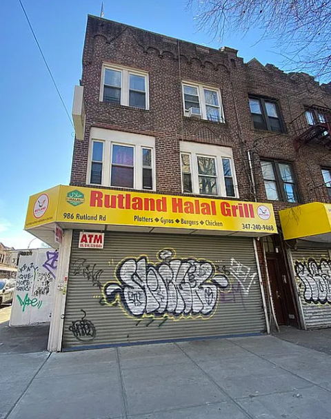 A building with a Rutland Halal Grill sign on the front.