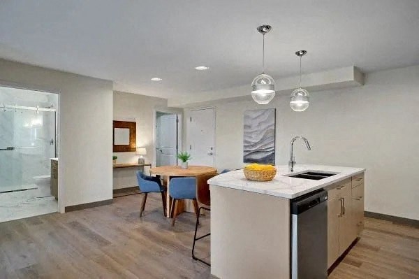 A modern kitchen with a dining table and chairs.