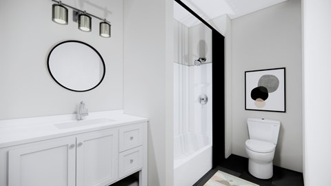 A bathroom with a white toilet and a white sink.