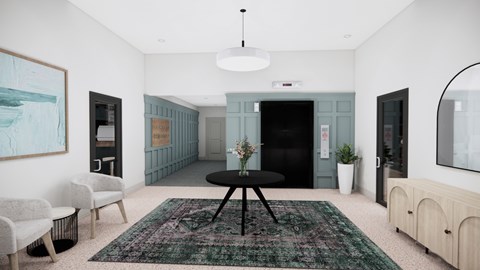 A room with a rug, chairs, and a table.