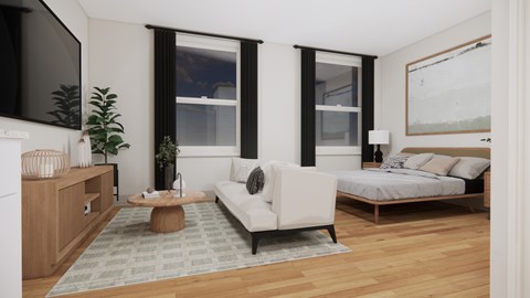 A living room with a white couch and a wooden coffee table.