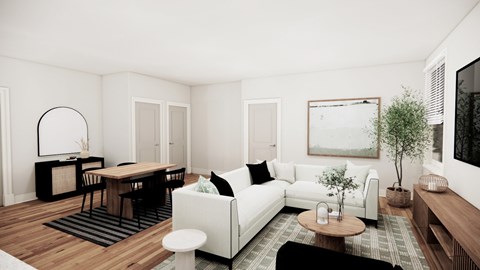 A modern living room with a white sofa, wooden coffee table, and a large painting on the wall.