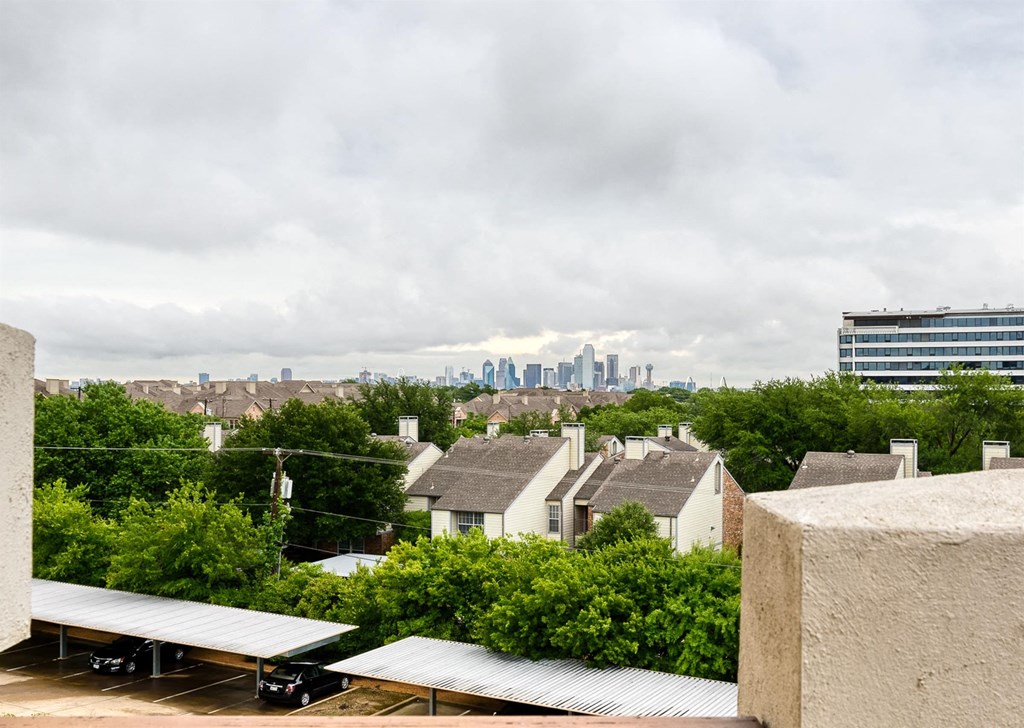 A view of a city skyline from a rooftop.