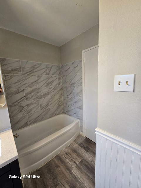A bathroom with a Galaxy S24 Ultra phone.