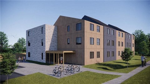 A modern building with a bicycle parked in front.