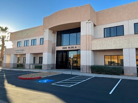 The image shows a building with the sign "Condo Keepers" and the address "2920 BLDG. 4".