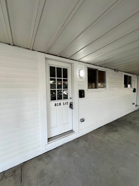 A white door with the number 818 1/2 on it.