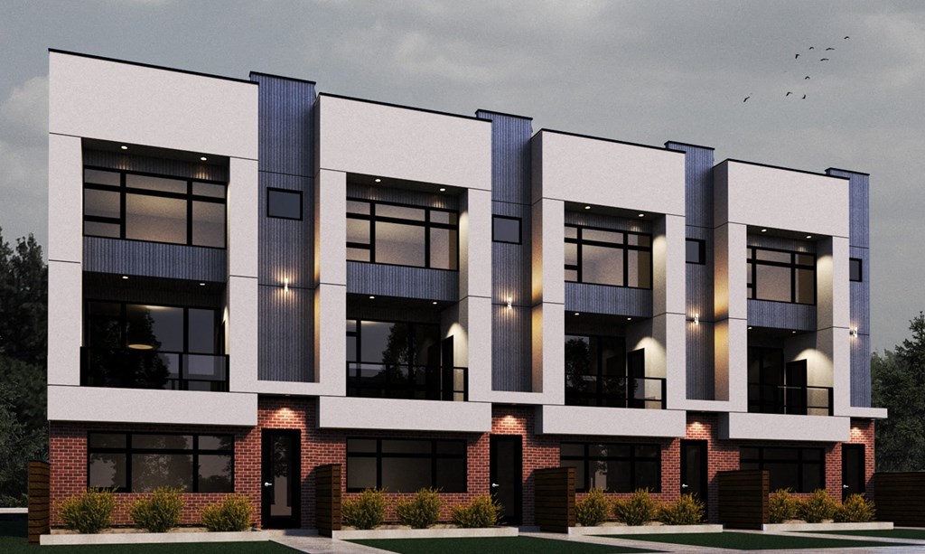 A modern apartment building with multiple balconies and large windows.