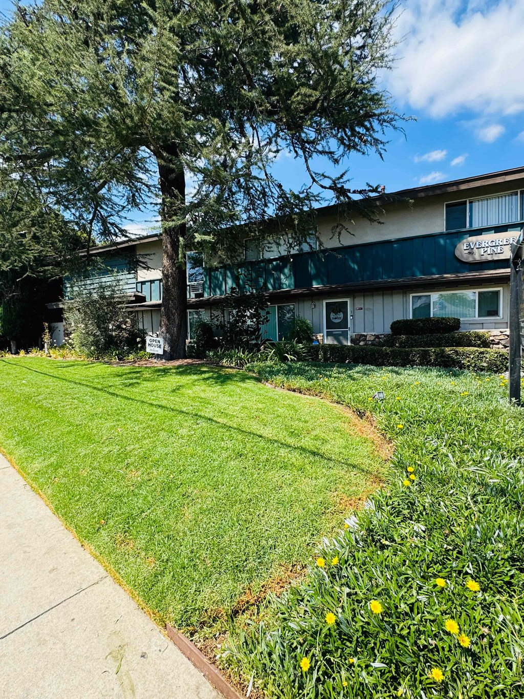 A building with a green lawn in front of it.