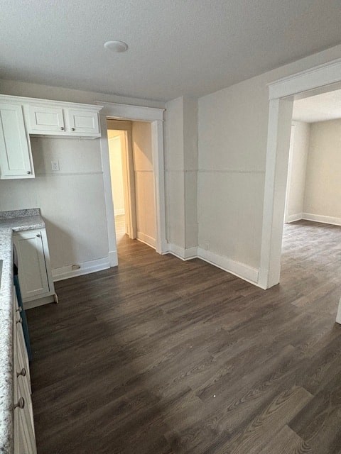 A room with wooden floors and white walls.