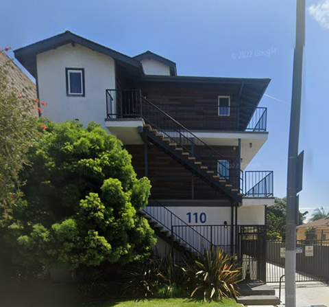 A house with the number 110 on the front.