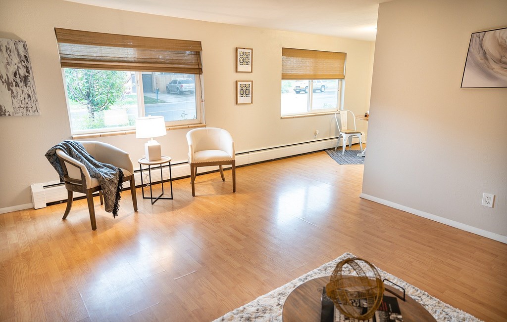 A living room with a chair and a table.