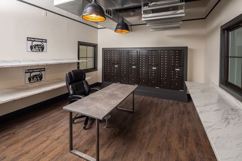 A conference room with a long table and a blackboard on the wall.