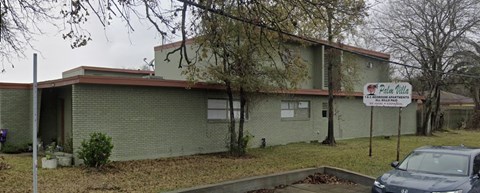 A building with a sign that says "Pine Valley".