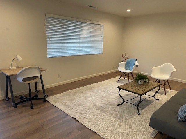 A room with a table, chairs, and a couch.