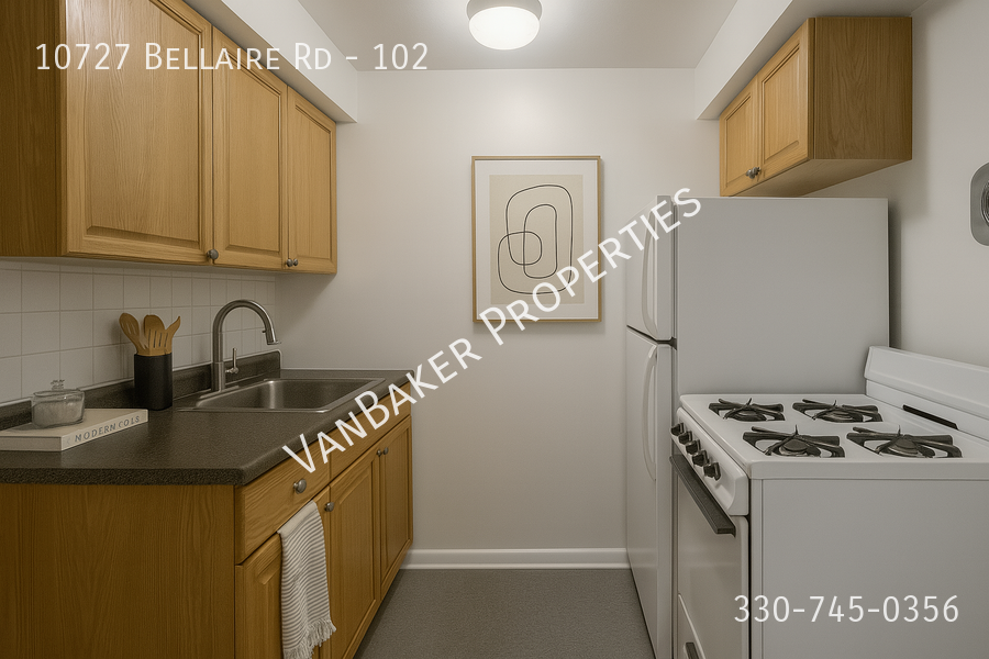 A kitchen with a white stove and wooden cabinets.
