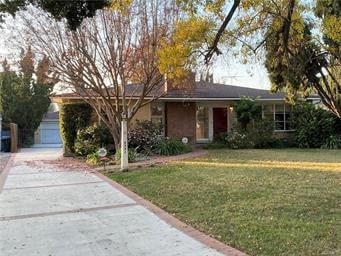 A house with a red door and a tree in front.