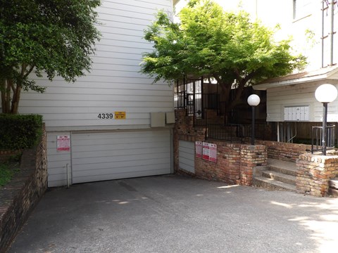 A white garage door with a red sign on it.