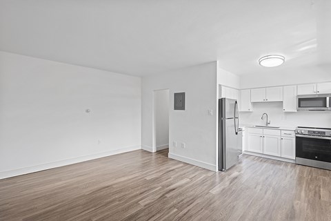 A kitchen with white cabinets and stainless steel appliances.